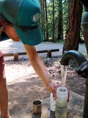 Dan Filling Bottles At Sacandaga Campground Pump